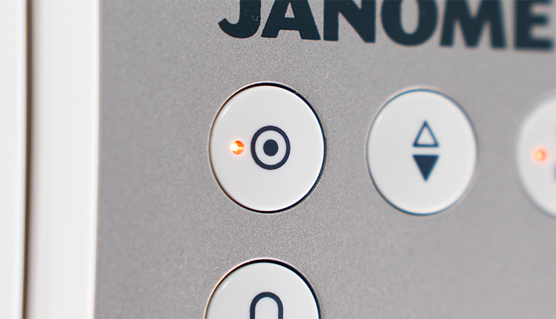 Janome Continental M8 Auto-lock button